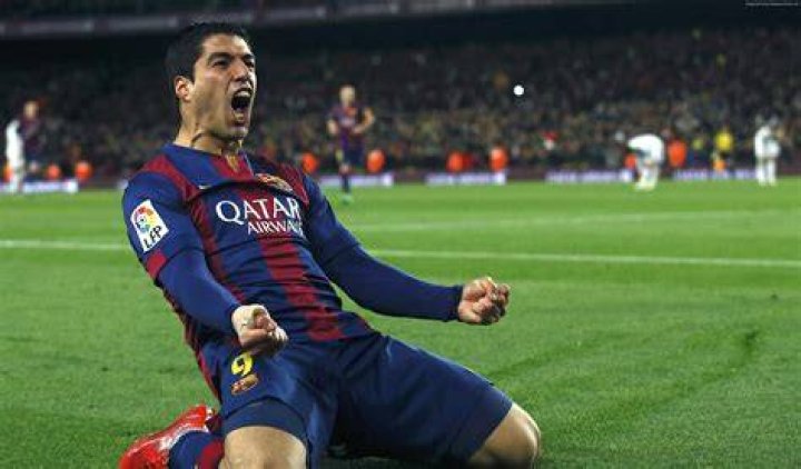 Barcelona striker Luis Suarez enjoys table football game with son