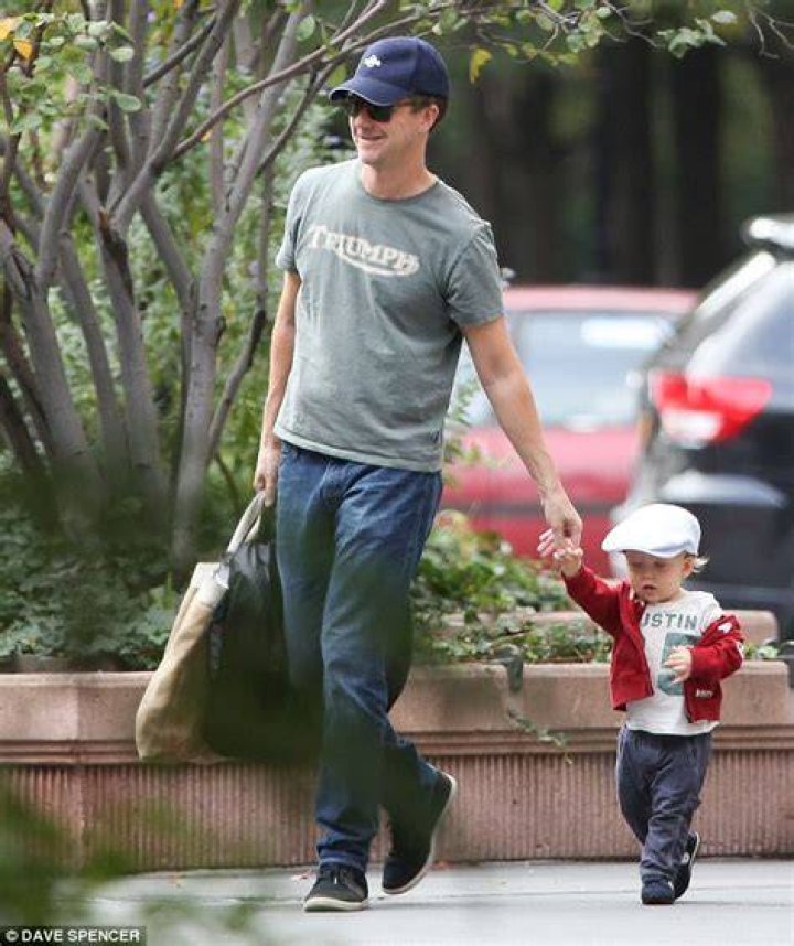 Doting dad Edward Norton showed how gentle he can be as he took his 17monthold son for in