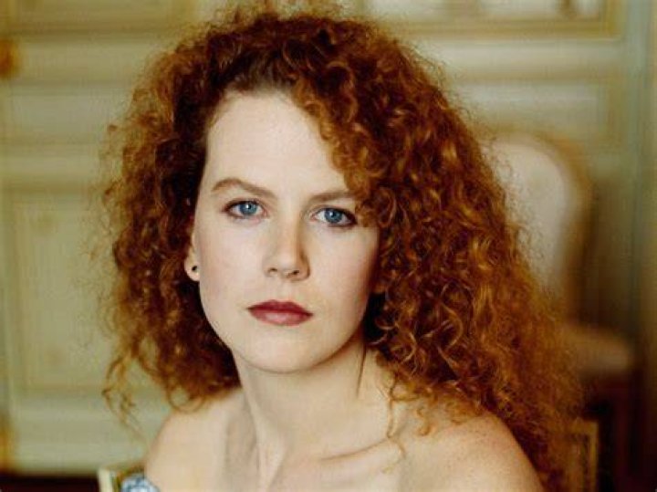 How old was Nicole Kidman with her first child? How many pregnancies