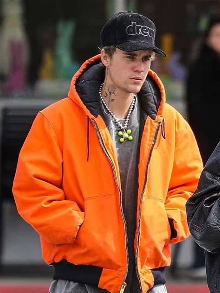 Justin Bieber Wears Orange and White Onesie on Date with Wife Hailey